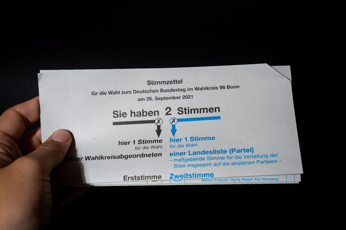 a person holding up a ticket for a concert